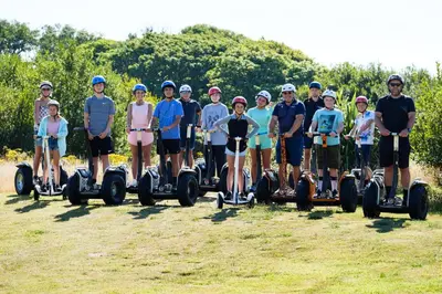 a group of people riding on segifts at Atlantic Reach Resort in Newquay