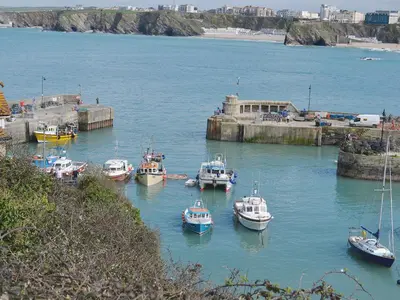 a group of boats are docked in a harbor at Little Lookover in Saint Columb Minor