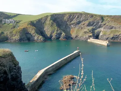 a large body of water with a bridge in it at Knights Den in Port Isaac