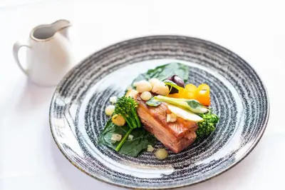 a plate of food with meat and vegetables on it at The Royal Duchy Hotel in Falmouth