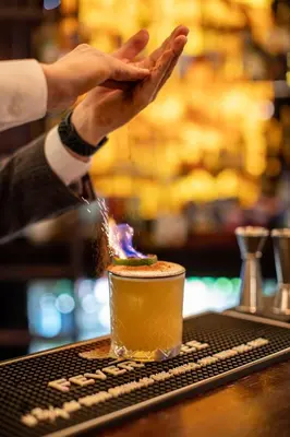 a person is making a drink on a bar at Penventon Park Hotel in Redruth