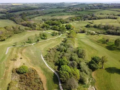 an aerial view of a winding road in a field at Trethorne Hotel & Golf Club in Launceston
