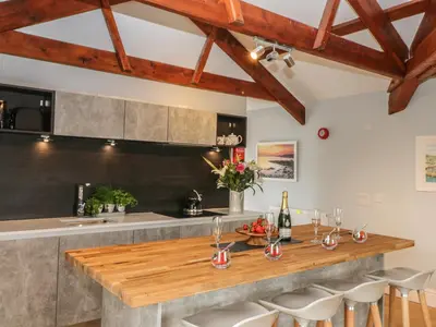 a kitchen with a wooden counter top in a room at Argal in Penryn
