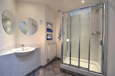 a bathroom with a shower and a sink at Mannings Hotel in Truro