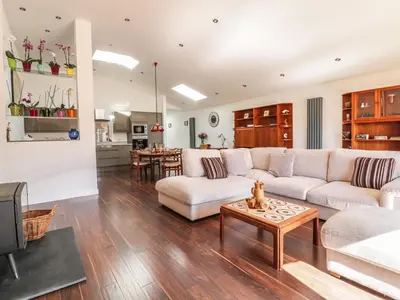 a living room with a couch and a table at Chy Lagen Hos in Newquay