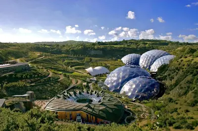 an aerial view of domes of a garden with trees at Par Sands Coastal Holiday park in Par