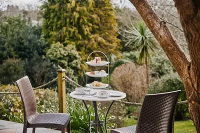 a table with cups and plates of food on it at The Alverton in Truro