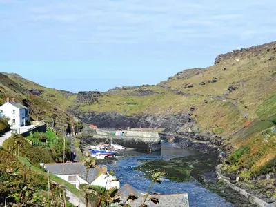 a river with a bunch of boats in the water at Moonraker in Port Isaac