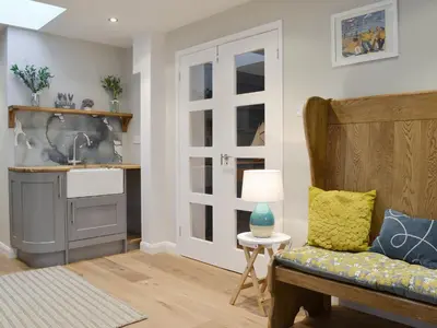 a living room with a couch and a sink at Treen in Lansallos
