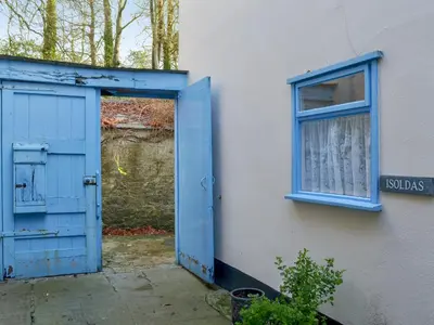 a blue door and a window on the side of a building at Tristan's - Ukc3906 in Lostwithiel