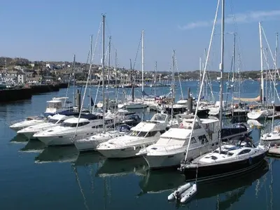 a bunch of boats are docked in a harbor at Hazel Barn in Falmouth