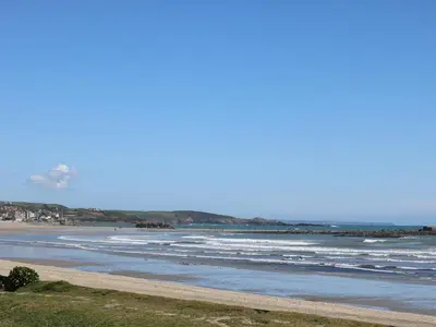 a view of a beach with waves in the ocean at Surfside in Marazion