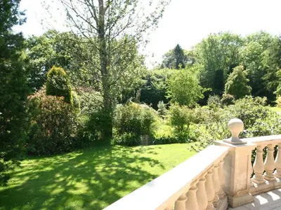 a view of a garden from the balcony of a house at Trelaze in Wadebridge