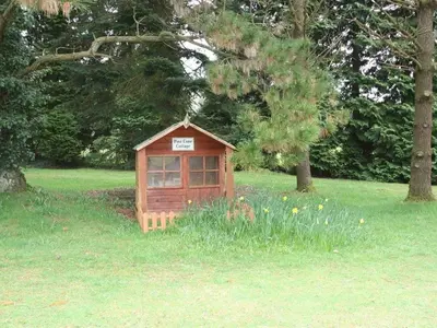 a small house in the middle of a field at Trelaze in Wadebridge