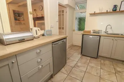 a kitchen with a sink and a counter top at Banneth in Mawgan