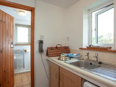 a kitchen with a sink and a window at Greenbank Farm in Saint Dennis