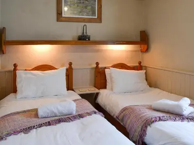 two beds sitting next to each other in a room at Provence-Uk12747 in Menheniot