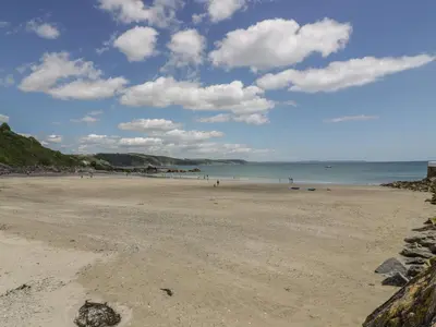 a view of a beach with people on it at Harbour View Apartment in Looe