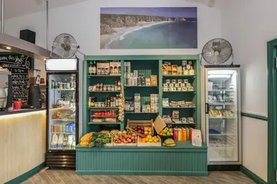 a produce section of a grocery store with fruits and vegetables at Deja Blue in Falmouth