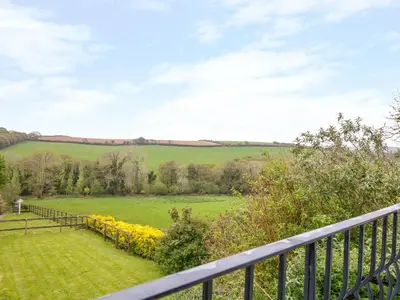 a view of a field from the balcony of a house at Forget-me-not in Saint Columb Major