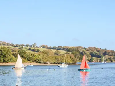 a group of boats floating on a body of water at The Old Cows House in Helston