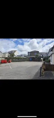 an empty parking lot with buildings in the background at Molesworth Arms in Wadebridge