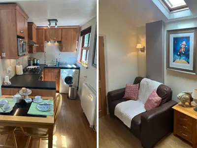 a kitchen and a living room with a couch and a table at Palmers Lodge in Launceston