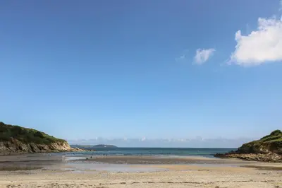 a view of a beach with the ocean in the background at Fox's Walk in Falmouth