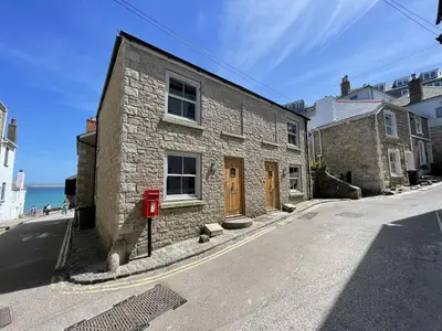 a stone building on the side of a street at Harrys Hideout in St Ives