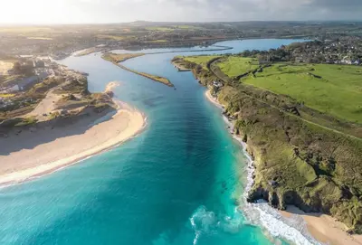 an aerial view of a beach and the ocean at Copperhouse View in Hayle
