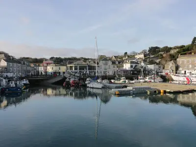 a body of water with boats in a harbor at Riversdale Cottage in Wadebridge