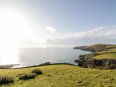 a view of the ocean from a bluff at 2 Rose Cottages in Looe