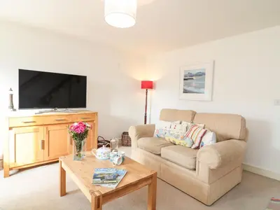 a living room with a couch and a table at Ripple in Bodmin