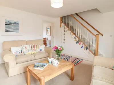 a living room with a couch and a table at Ripple in Bodmin
