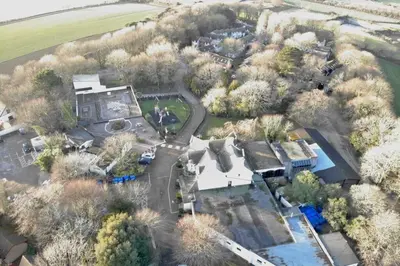 an aerial view of a house with a yard at 20 Tudor Court 