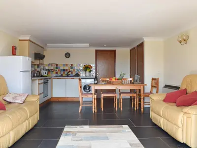 a living room with two couches and a table at Swallows Nest - Uk12085 in Saint Endellion
