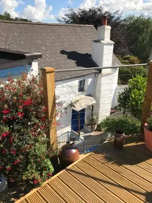 a view from the deck of a house at Truly Paradise Cottage in Golant