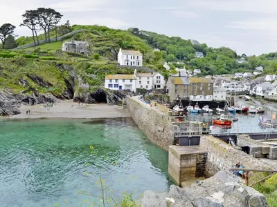 a body of water with boats in a harbor at Laity in Polperro