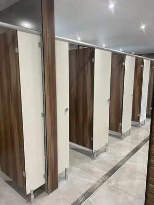 a row of wardrobes with wooden doors at Chalet 26 Widemouth Bay in Bude
