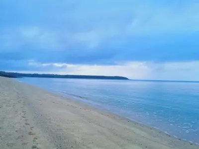 a sandy beach with the ocean in the background at Number 6 in St Austell