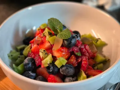 a white bowl filled with fruits and vegetables at Number 6 in St Austell