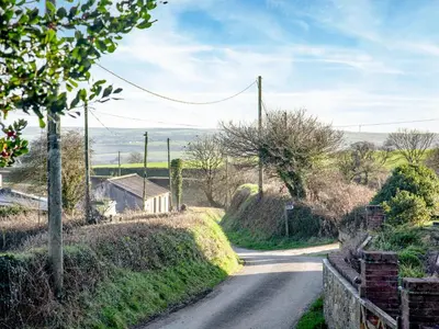 a winding road in a village on a hill at Vredehoek in Quethiock