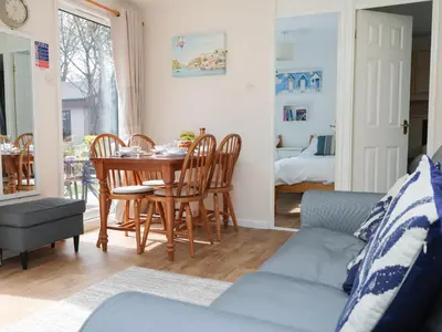 a dining room with a table and chairs at Miles Retreat in Hayle