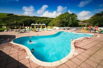 a large swimming pool with people in it at NB12 Entire Caravan - Newquay in Porth