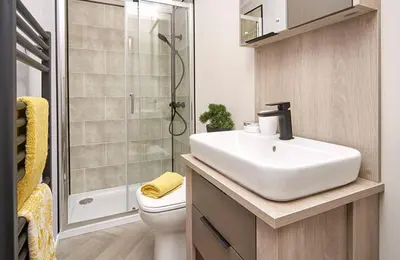 a bathroom with a sink and a shower and a toilet at 1.2 padstow in Padstow