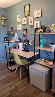 a room with a desk with a chair and shelves at Lansdowne Simply Stay in Redruth
