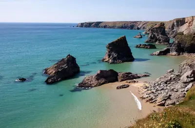 a view of a beach with rocks in the water at Birch House in St. Agnes