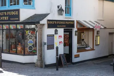 a group of shops on a street in a city at Nori's Nest, Croft Hooper - Hot Tub - Free WiFi & Parking - Fire Pit in Ludgvan
