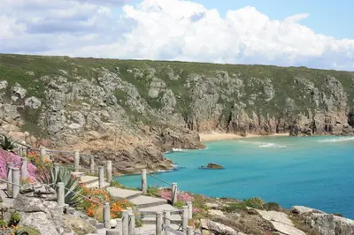 a stairway leading to a beach with a cliff at Little Chyryn Perranuthnoe in Perranuthnoe