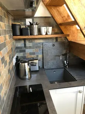 a kitchen with a sink and a counter top at Piala retreat in Phillack